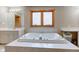 Bathroom features a large tub, tile surround, and vanity with sink at 8371 N 400 W, Fairland, IN 46126