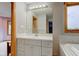 Bathroom with white vanity, undermount sink, and large mirror at 8371 N 400 W, Fairland, IN 46126