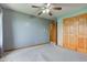 Bedroom features standard closet with natural trim and a ceiling fan at 8371 N 400 W, Fairland, IN 46126