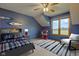 Stylishly furnished bedroom with a comfortable bed, a ceiling fan, a desk and a bright window at 8371 N 400 W, Fairland, IN 46126