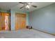 Bedroom features standard closet with natural trim and a ceiling fan at 8371 N 400 W, Fairland, IN 46126