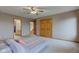 Spacious bedroom featuring carpet, neutral-colored walls, natural lighting, and a ceiling fan at 8371 N 400 W, Fairland, IN 46126
