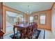 Formal dining room with chandelier, wood table, and floral rug, creating an inviting space for meals at 8371 N 400 W, Fairland, IN 46126