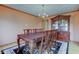 Formal dining room features an elegant chandelier, wood table with ornate details, and classic china cabinet at 8371 N 400 W, Fairland, IN 46126