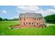 Brick home backyard aerial showcasing an expansive lawn and a deck for outdoor living and entertaining at 8371 N 400 W, Fairland, IN 46126