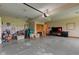 Well-lit garage includes storage solutions, with an accessible garage door and organized arrangement at 8371 N 400 W, Fairland, IN 46126