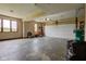 Spacious two-car garage featuring ample storage, a window for natural light, and a functional garage door at 8371 N 400 W, Fairland, IN 46126