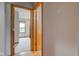 Hallway view into a bedroom with a window and carpet at 8371 N 400 W, Fairland, IN 46126