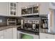 The kitchen features stainless steel appliances, granite countertops and white cabinetry for ample storage at 8371 N 400 W, Fairland, IN 46126