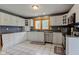 This kitchen features white cabinets, granite countertops, a large window, and stainless steel appliances at 8371 N 400 W, Fairland, IN 46126