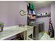 Laundry room with marble countertop, utility sink, stainless steel washer/dryer, and ample shelving for storage at 8371 N 400 W, Fairland, IN 46126