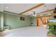 Bright living room with wooden beams, open layout, and view of the home's entrance, ideal for entertaining at 8371 N 400 W, Fairland, IN 46126