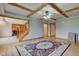 Bright living space featuring a hardwood floor, staircase, large patterned rug, and detailed ceiling at 8371 N 400 W, Fairland, IN 46126