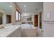 Large bathroom features a large tub, dual vanities, and tile flooring at 8371 N 400 W, Fairland, IN 46126