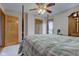 Spacious main bedroom featuring a canopy bed, natural light and wood trim at 8371 N 400 W, Fairland, IN 46126