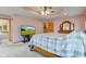 Spacious main bedroom features a tray ceiling, TV, and a large bed at 8371 N 400 W, Fairland, IN 46126