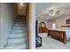 Inviting main bedroom boasts a tray ceiling and ensuite access, complemented by a staircase at 8371 N 400 W, Fairland, IN 46126