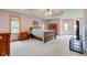 Spacious main bedroom suite with tray ceiling, neutral walls, and multiple windows at 8371 N 400 W, Fairland, IN 46126