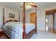 Bright main bedroom featuring a canopy bed and wood trim at 8371 N 400 W, Fairland, IN 46126