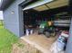 Interior view of a garage featuring a tractor and a boat, showing ample storage space at 8371 N 400 W, Fairland, IN 46126