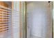 Walk-in shower is beautifully tiled and has a bench and glass door at 8371 N 400 W, Fairland, IN 46126