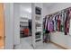Spacious walk-in closet featuring built-in shelving and ample hanging space for organized storage at 8371 N 400 W, Fairland, IN 46126