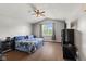Main bedroom features wood-look floors, vaulted ceilings, and ample natural light at 9125 Timpani Way, Indianapolis, IN 46231