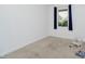 Bright bedroom with a window offering natural light and a rocking chair with toys at 9363 Hadway Dr, Indianapolis, IN 46256