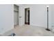 Neutral carpeted bedroom with white walls, closet and an open doorway leading into another room at 9363 Hadway Dr, Indianapolis, IN 46256