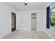 Bright bedroom featuring neutral carpet, a closet and view of the exterior through a window at 9363 Hadway Dr, Indianapolis, IN 46256