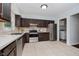 Well-appointed kitchen with stainless steel appliances, ample cabinet space, and tile flooring at 9363 Hadway Dr, Indianapolis, IN 46256