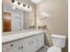 Bright bathroom featuring a large mirror and a shower with a white vanity at 9458 Dawn Dr, Brownsburg, IN 46112