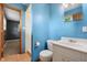 Updated bathroom with a white vanity, toilet, and a separate shower area at 9458 Dawn Dr, Brownsburg, IN 46112