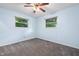 Bedroom with two windows offering natural light and a ceiling fan at 9458 Dawn Dr, Brownsburg, IN 46112