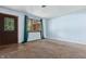 Bright, airy living room featuring freshly painted walls, neutral carpet, and natural light from the window at 9458 Dawn Dr, Brownsburg, IN 46112