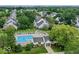 Aerial view of a community pool surrounded by lush landscaping and well-maintained homes at 9664 Legare St # 2601, Fishers, IN 46038