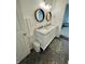 Bathroom showcasing a double sink vanity with countertop, stylish mirrors, and updated fixtures at 9664 Legare St # 2601, Fishers, IN 46038