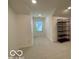 Bright bonus room features neutral paint, carpet and a storage unit at 9664 Legare St # 2601, Fishers, IN 46038