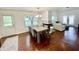 Hardwood floors highlight the dining area, complete with table and chairs and an adjacent open-concept living room at 9664 Legare St # 2601, Fishers, IN 46038