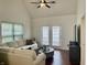Cozy living room with plush seating, natural light, and access to the patio through the sliding glass doors at 9664 Legare St # 2601, Fishers, IN 46038