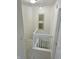 Bright stairwell features neutral walls and carpet, and white painted rails at 9664 Legare St # 2601, Fishers, IN 46038