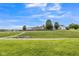 Backyard features a lush green landscape and walking path, backing onto other residences at 9692 Centennial Ct, Avon, IN 46123