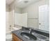 A full bathroom with a shower and a black granite countertop at 9692 Centennial Ct, Avon, IN 46123
