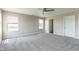 A bedroom with carpet flooring, multiple windows and neutral walls at 9692 Centennial Ct, Avon, IN 46123