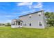 Two-story home features a screened-in porch and vinyl siding, nestled in a green backyard at 9692 Centennial Ct, Avon, IN 46123