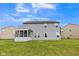 Home exterior with a screened porch, vinyl siding, and a well-maintained backyard at 9692 Centennial Ct, Avon, IN 46123