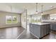 Gourmet kitchen featuring gray cabinetry, stainless steel appliances, and an island at 9692 Centennial Ct, Avon, IN 46123