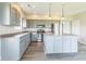 An updated kitchen features gray cabinets and a center island at 9692 Centennial Ct, Avon, IN 46123