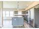 Gourmet kitchen featuring gray cabinetry, stainless steel appliances, and an island at 9692 Centennial Ct, Avon, IN 46123