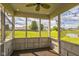 Screened-in porch offers serene views of lush green space and community pond at 9692 Centennial Ct, Avon, IN 46123